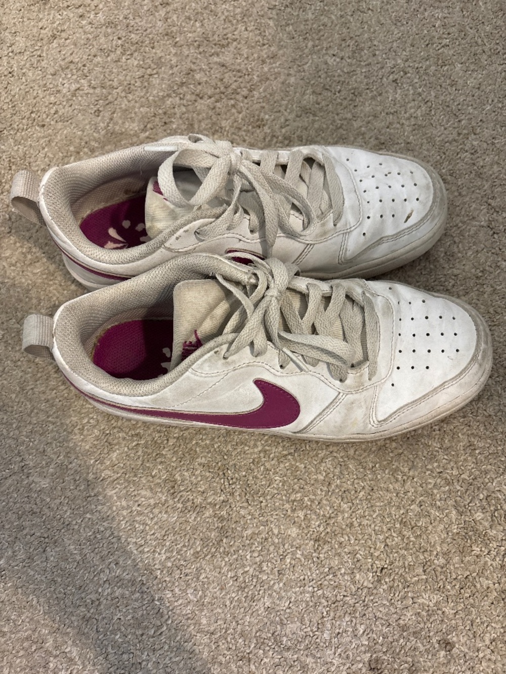 white and magenta nike shoes